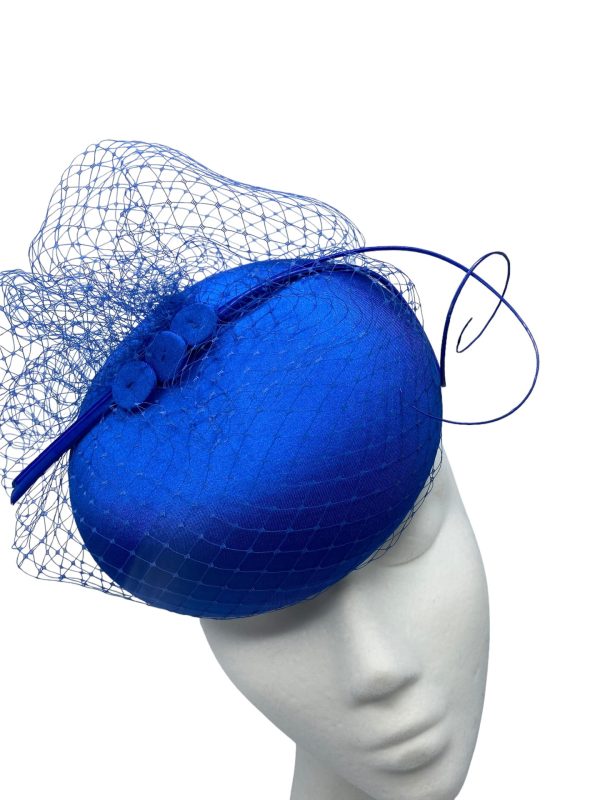 Stunning versatile blue headpiece with veiled base and matching blue quill detail.